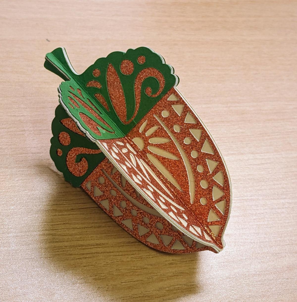 An example picture of the craft. A 3D acorn made from paper.